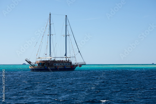 Big ship with masts sailing in the Red Sea