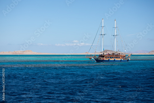 Big ship with high masts sailing in the Red Sea