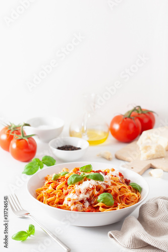 tagliatelle pasta with tomato sauce parmesan basil