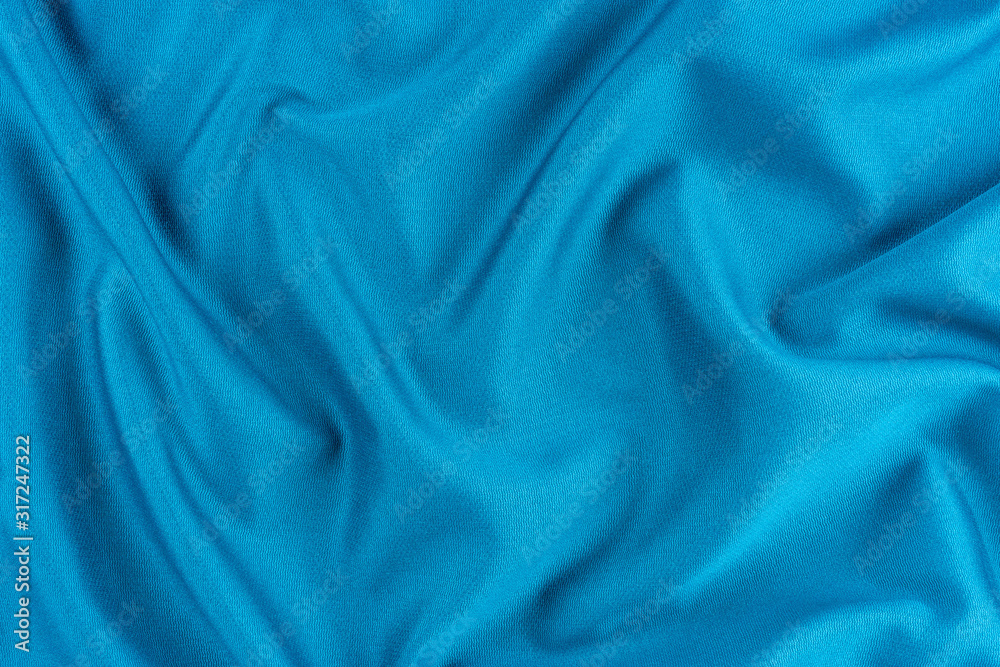 Bright blue fabric texture with folds. Bright blue fabric texture with folds.