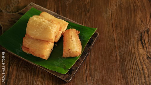 Deep fried cassava root. Brazilian Mandioca Frita (deep fried cassava/ manioc/yuca). Feijoada side dish photo