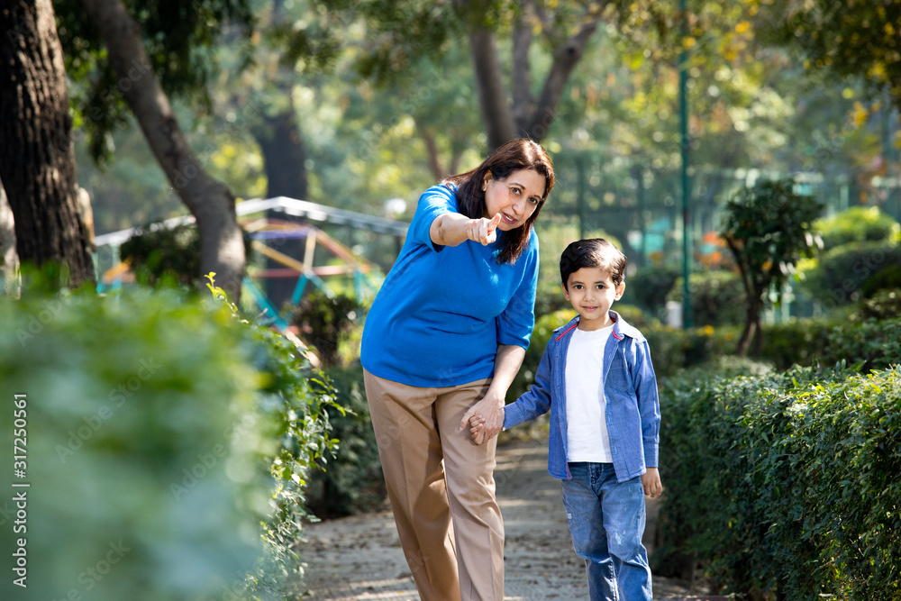 Cheerful grandmother spending leisure time with grandson Cheerful grandmother spending leisure time with grandson