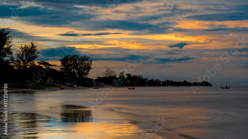 Fototapeta Naklejka Na Ścianę i Meble -  Reflection of coastline of Pak Nam Pran at dusk in Thailand
