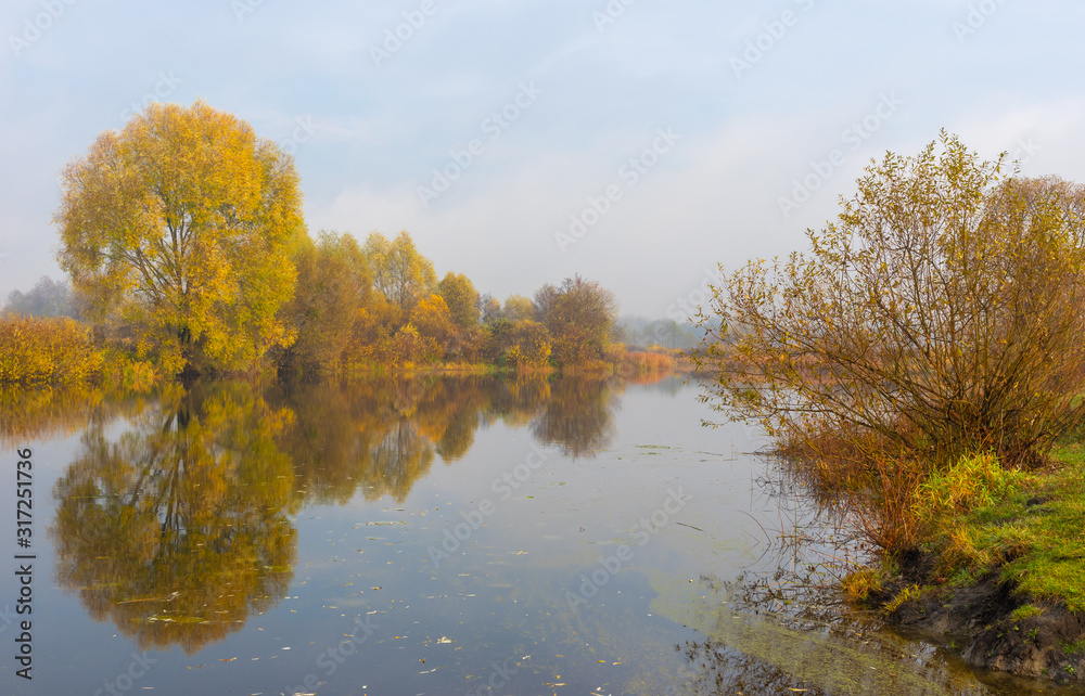 Morning landscape in pastel shades with Vorskla river at autumnal season in Sumskaya oblast, Ukraine