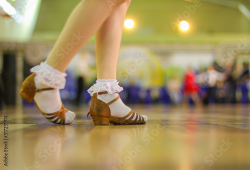Girl dancing ballroom dancing on the dance floor © natali