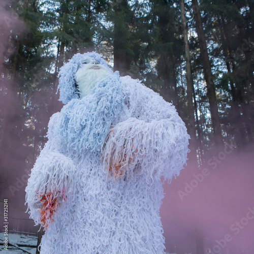 Yeti fairy tale character in winter forest.