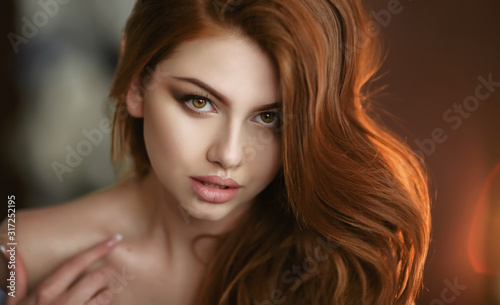 Portrait of a young model close up with red hair.