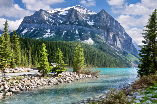 The beautiful turquoise glacial Lake Louise in Banff National Park. One of the most famous Canadian lakes