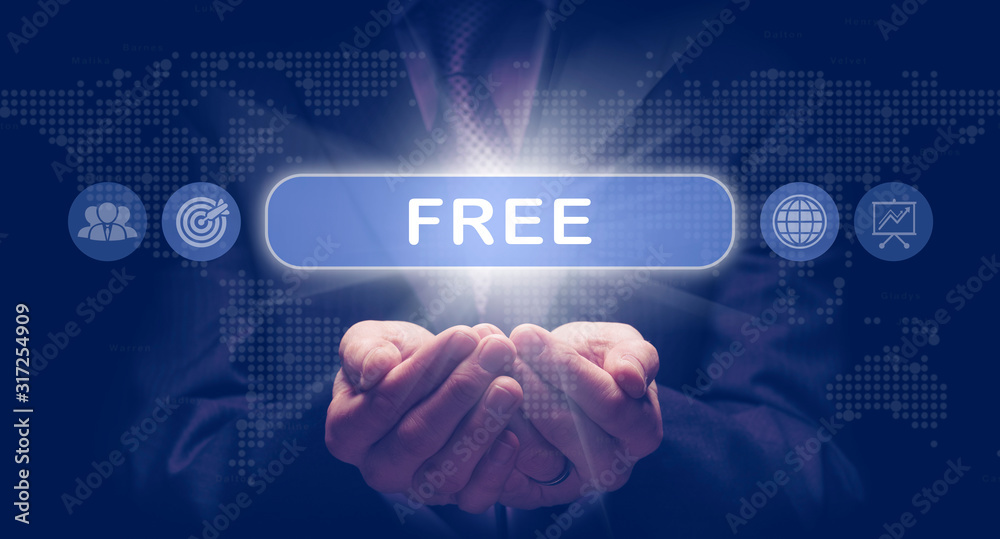 Businessmans cupped hands holding an Free business concept on a computerised display. Businessmans cupped hands holding an Free business concept on a computerised display.