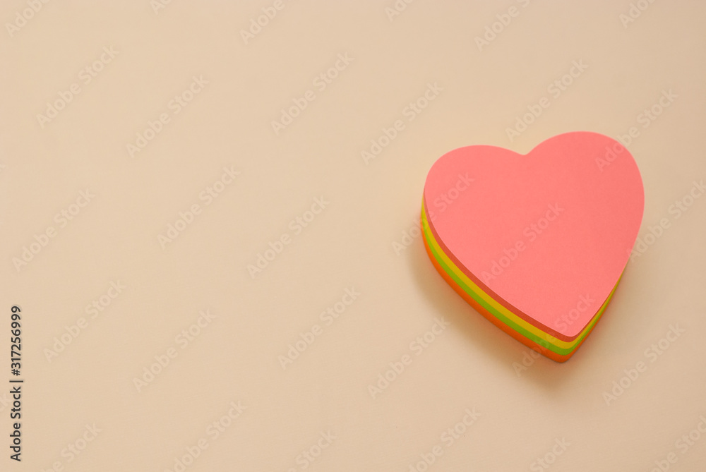 Heart shape paper note with a pen. Copy space