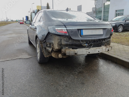 Damaged vehicle after car accident parked on the roadside