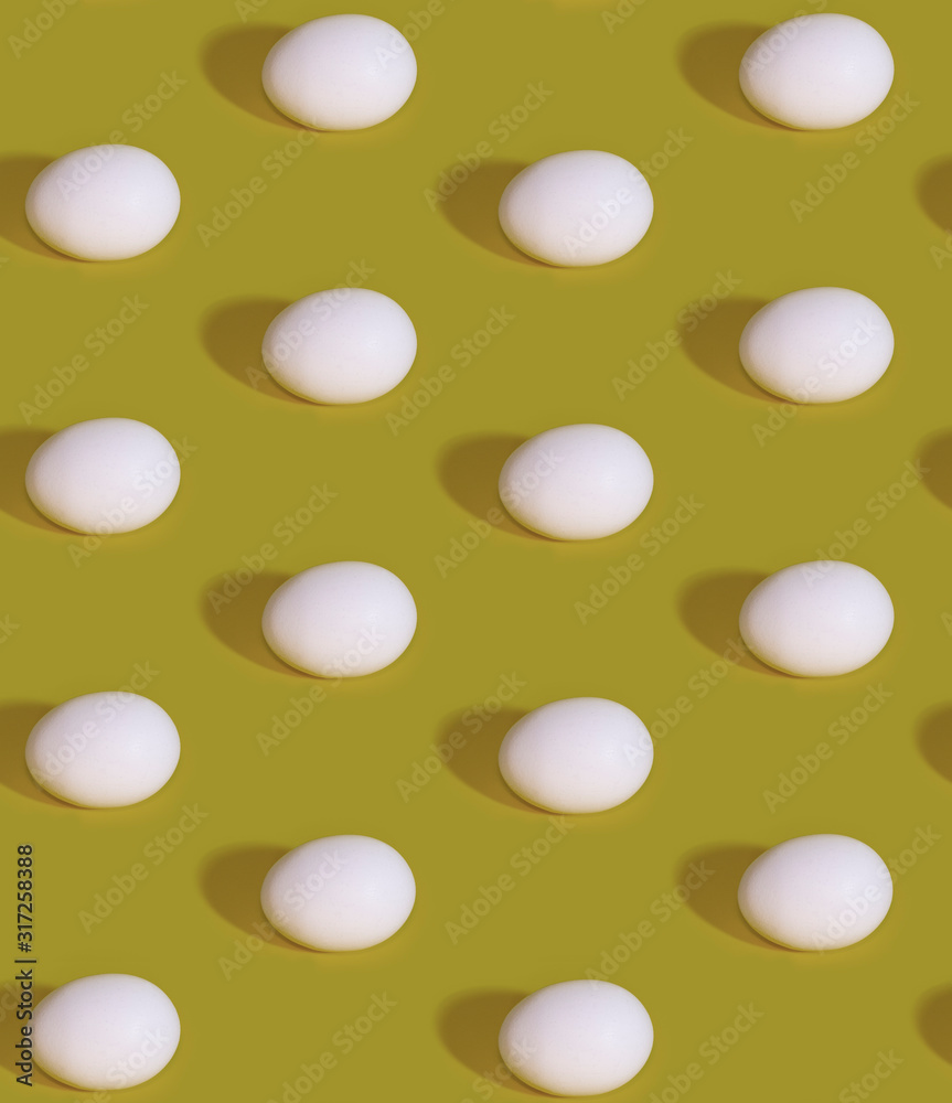 Seamless Pattern of white eggs on a khaki green background. Easter template
