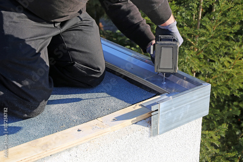 Plumbing work on a flat roof photo