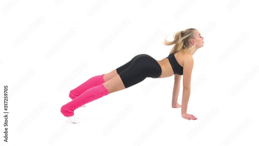 Beautiful young sportswoman downward facing dog pose (adho mukha svanasana pose) performing stretching exercises Beautiful young sportswoman downward facing dog pose (adho mukha svanasana pose) performing stretching exercises
