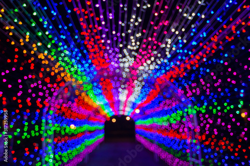 Blurry LED light tunnel on night for background.