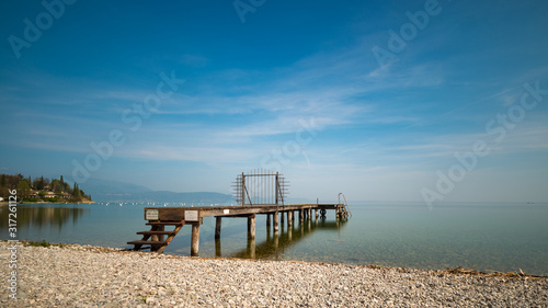 a jetty at lake Garda Italy