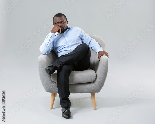 African-American man relaxi...