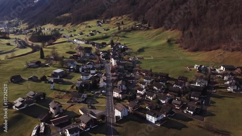 Aerial shot left to right of Nidfurn - Haslen Switzerland and the houses below. photo