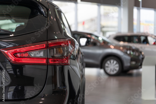Cars for sale. Automotive Industry. Cars dealership parking lot. Image of new vehicles in car showroom © Aleksandr
