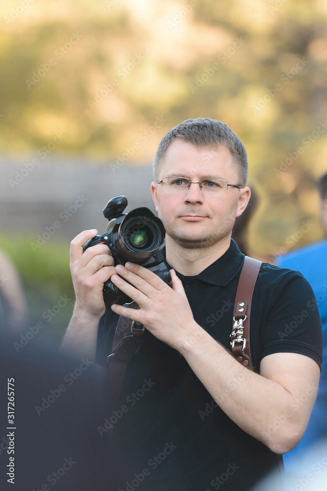 portrait of photographer with camera portrait of photographer with camera