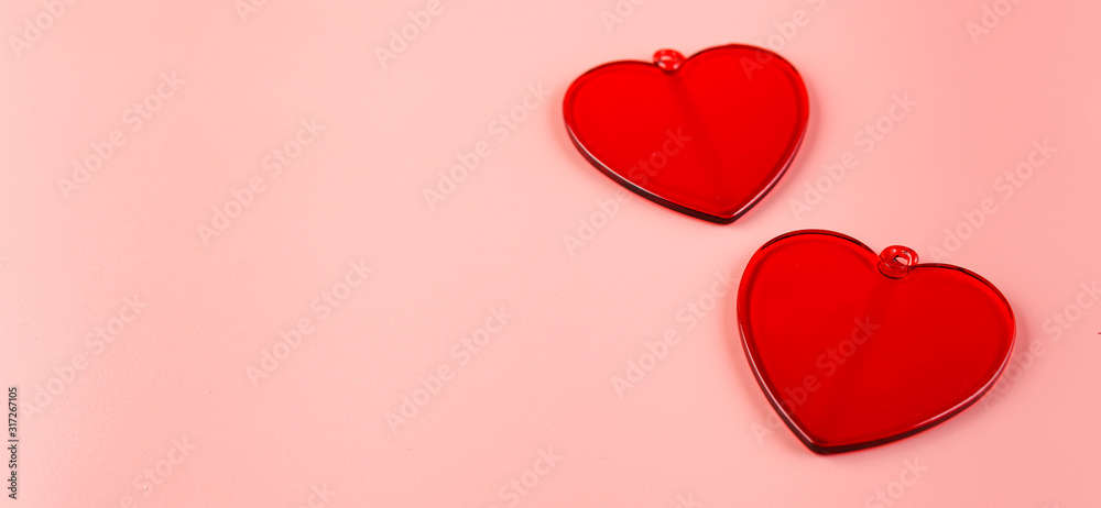 Decorative hearts on pink background. Place for text.