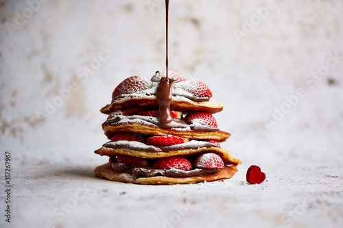 Close up of chocolate and strawberry pancake photo