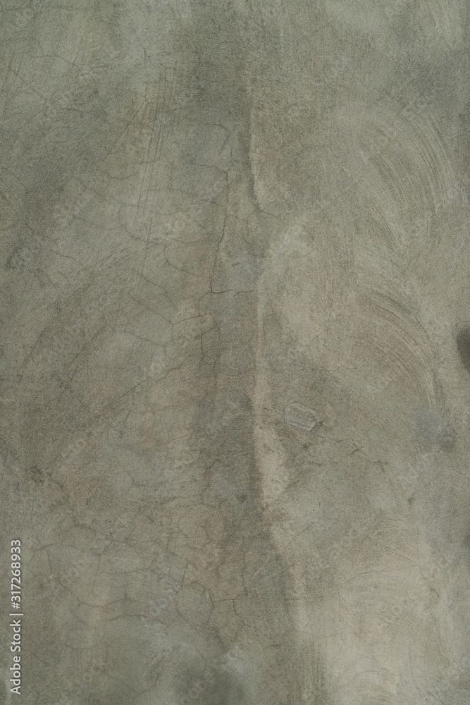Naklejka premium Unfinished wall background. Grey cement wall background