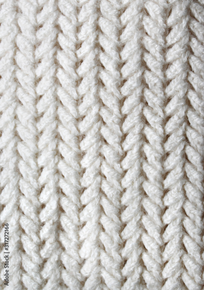 Knitting. Patterns. Natural yarn. Cotton. Wool. White and beige background. Knitting. Patterns. Natural yarn. Cotton. Wool. White and beige background.