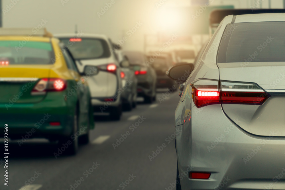 Brake light of luxury  car stop on the highway. During the evening traffic in city.