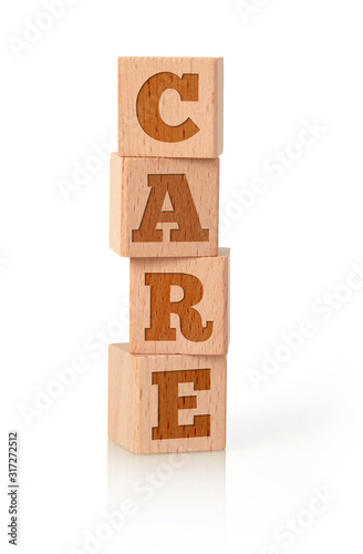 Care word on wooden cubes