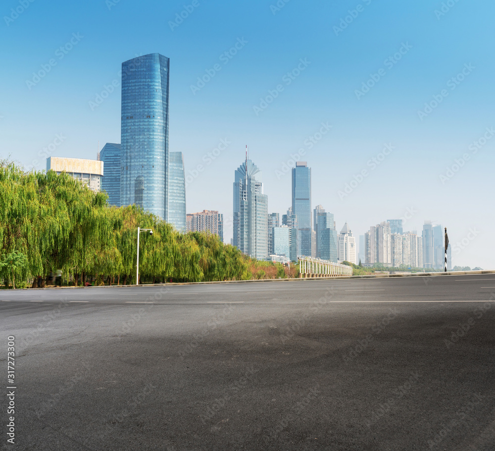 Asphalt road and modern city