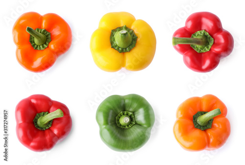 Set of different ripe bell peppers on white background, top view