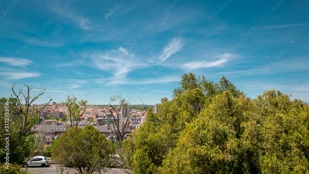 Panoramic view of the downtown Madrid from the famous park Las Vistillas in Spain on a sunny day during the traditional festival in May called San Isidro in the capital of Spain