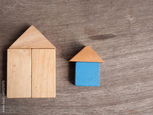 Wooden house toy with wood background