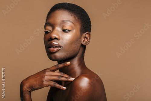 Beauty portrait of young half-naked african woman with short black hair © Drobot Dean