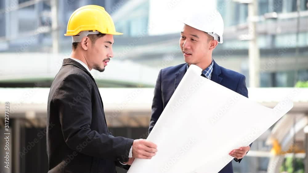 Construction engineer teamwork Safety Suit Trust Team Holding White Yellow Safety hard hat Security Equipment on Construction Site. Hardhat Protect Head for Civil Construction Engineer Concept Construction engineer teamwork Safety Suit Trust Team Holding White Yellow Safety hard hat Security Equipment on Construction Site. Hardhat Protect Head for Civil Construction Engineer Concept