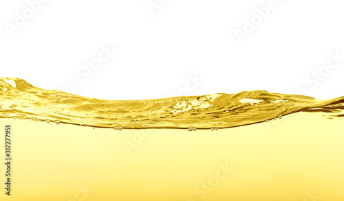 Flow of natural cooking oil on white background