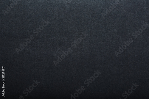 The texture of a black blank page tablet for pastels. Black background of paper texture.
