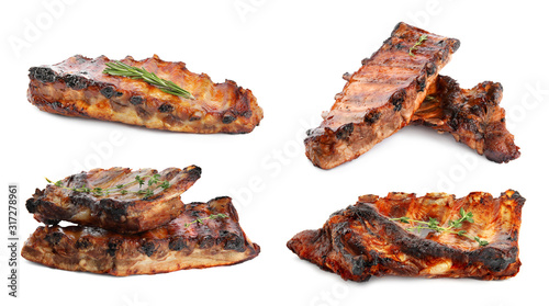 Set of delicious roasted ribs on white background