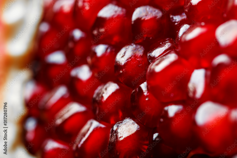 Red ripe and juicy seeds of fresh pomegranate fruit close-up. Red ripe and juicy seeds of fresh pomegranate fruit close-up.
