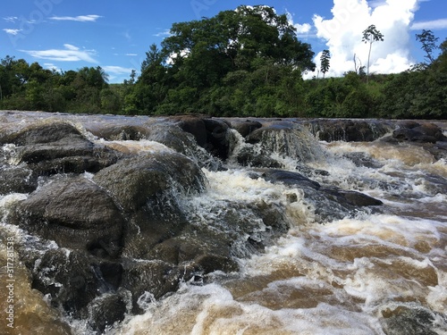 River and Rocks Under the Blue Sky