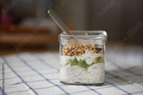 Yogurt and muesli in glass jar