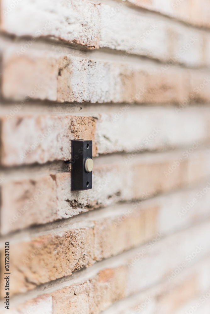 door bell brick wall