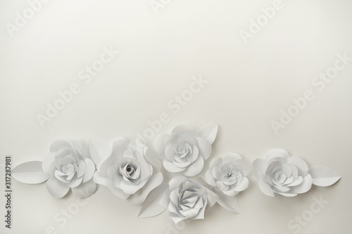 White paper flowers closeup with copy space on upper part. 