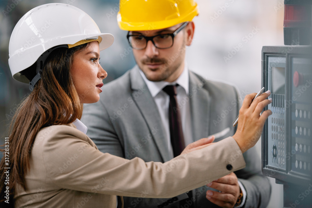 Architects working on construction project. Man and woman discussing work. Architects working on construction project. Man and woman discussing work.
