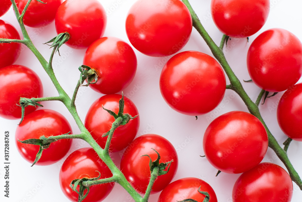 Top View Red Cherry Tomatoes with Green Branch on White Background Top View Red Cherry Tomatoes with Green Branch on White Background