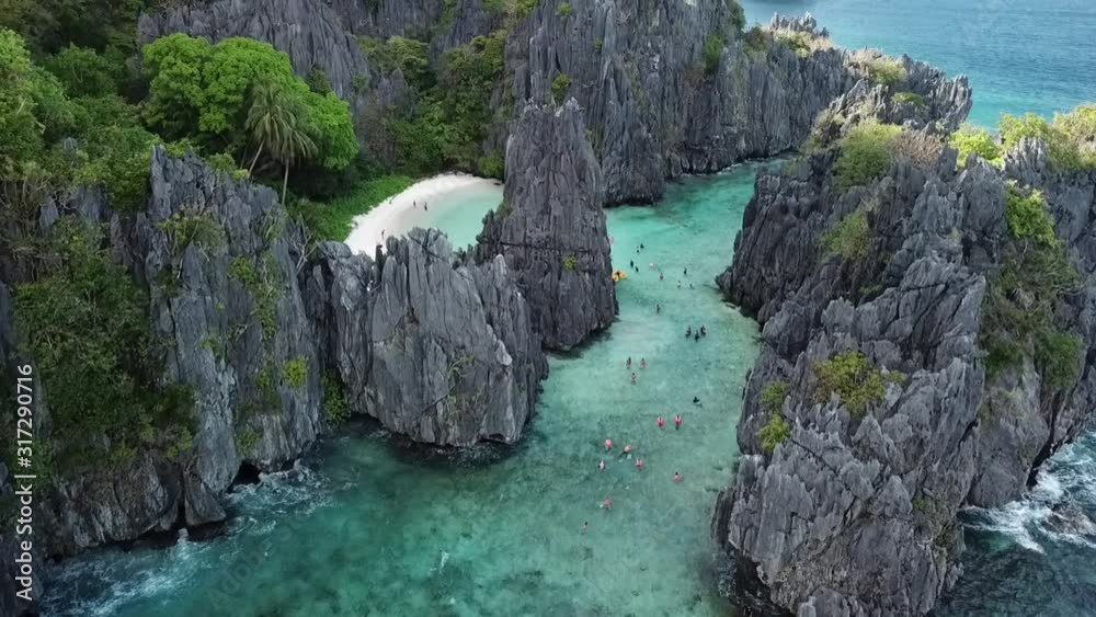 Aerial Drone Shot of El Nido Philippines Mountain Ranges with Turquoise Coral Reef Ocean Below Aerial Drone Shot of El Nido Philippines Mountain Ranges with Turquoise Coral Reef Ocean Below