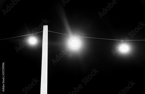 Electric lights at night in black and white
