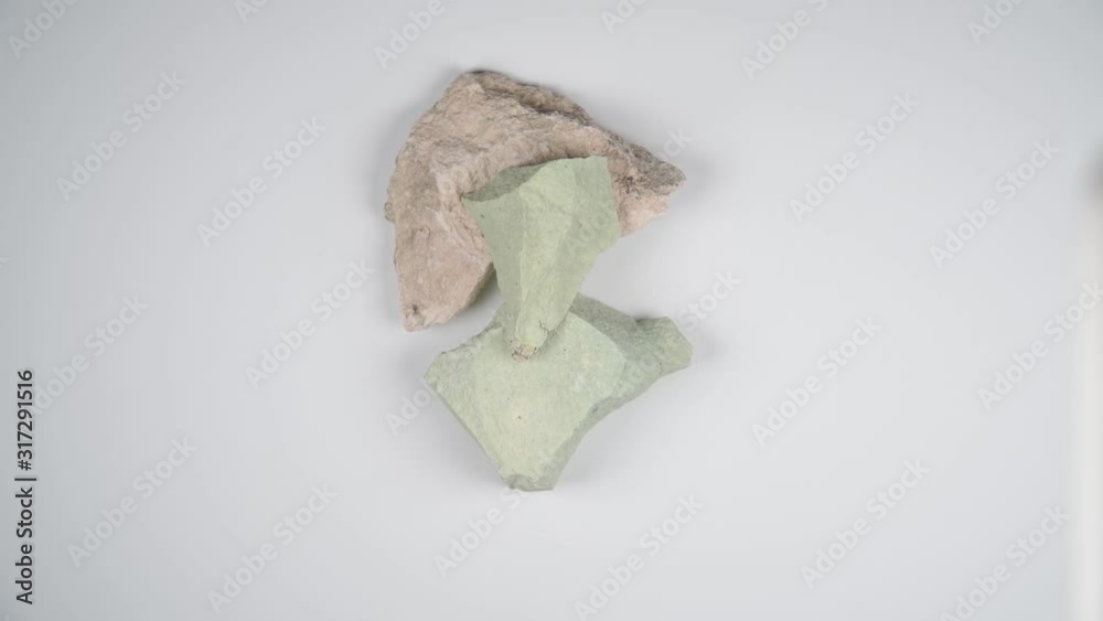 Close up stone of Zeolite mesolite raw stones on white background. Close up stone of Zeolite mesolite raw stones on white background.