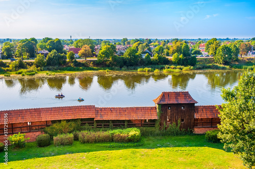 Aerial panoramic view of the external defense walls Nogat river surrounding the medieval Teutonic Order Castle in Malbork, Poland